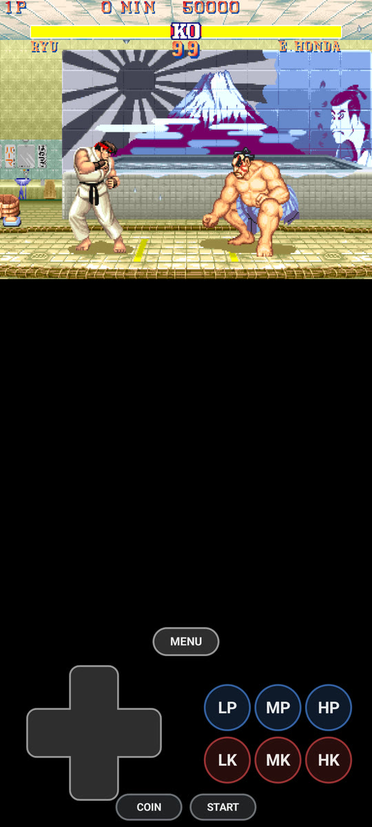An arcade game playing across the top of a phone with its own buttons underneath.
